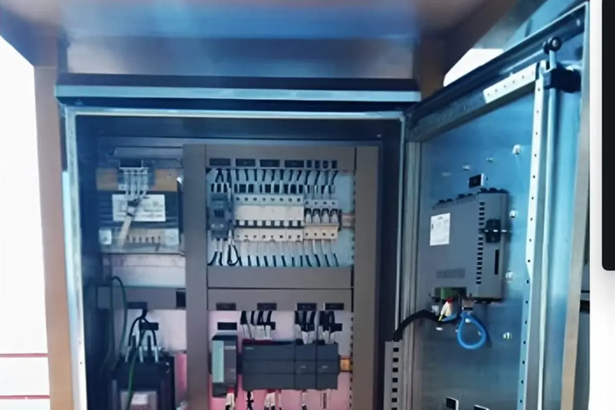 Fuel gas super heater control panel open, showing internal control gear and wiring